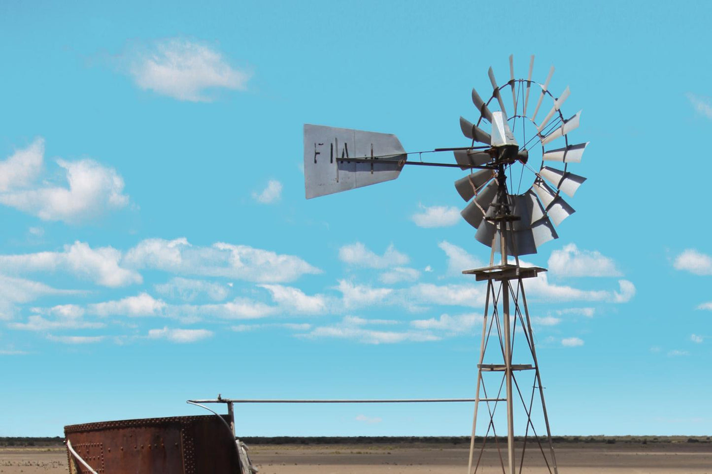 Windmill In The Field By Anna Coppel - Light Blue